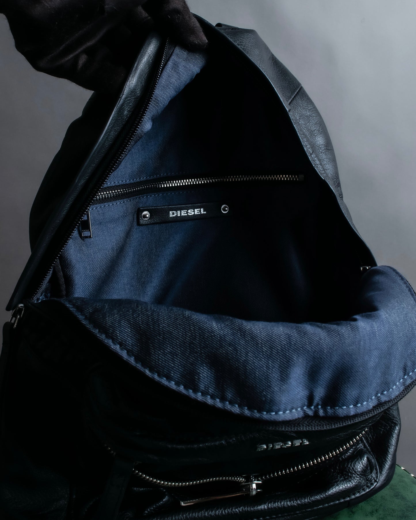 "DIESEL" Decorative zip design leather backpack