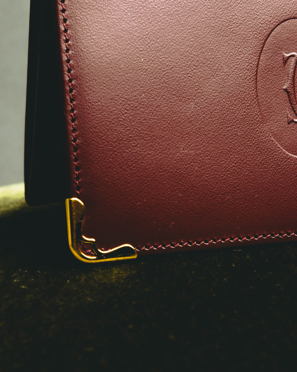 “Cartier” 90’s Must de Cartier burgundy embossed leather bifold wallet