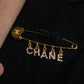 "CHANEL" Logo motif gold safety pin brooch