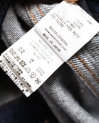 内側の品質表示タグを捉えたカット。品番 L252ND1003UAZDQ、モデル名 HUMBIE DENIM JK、綿100パーセントの本体素材と日本製表記が確認できます。