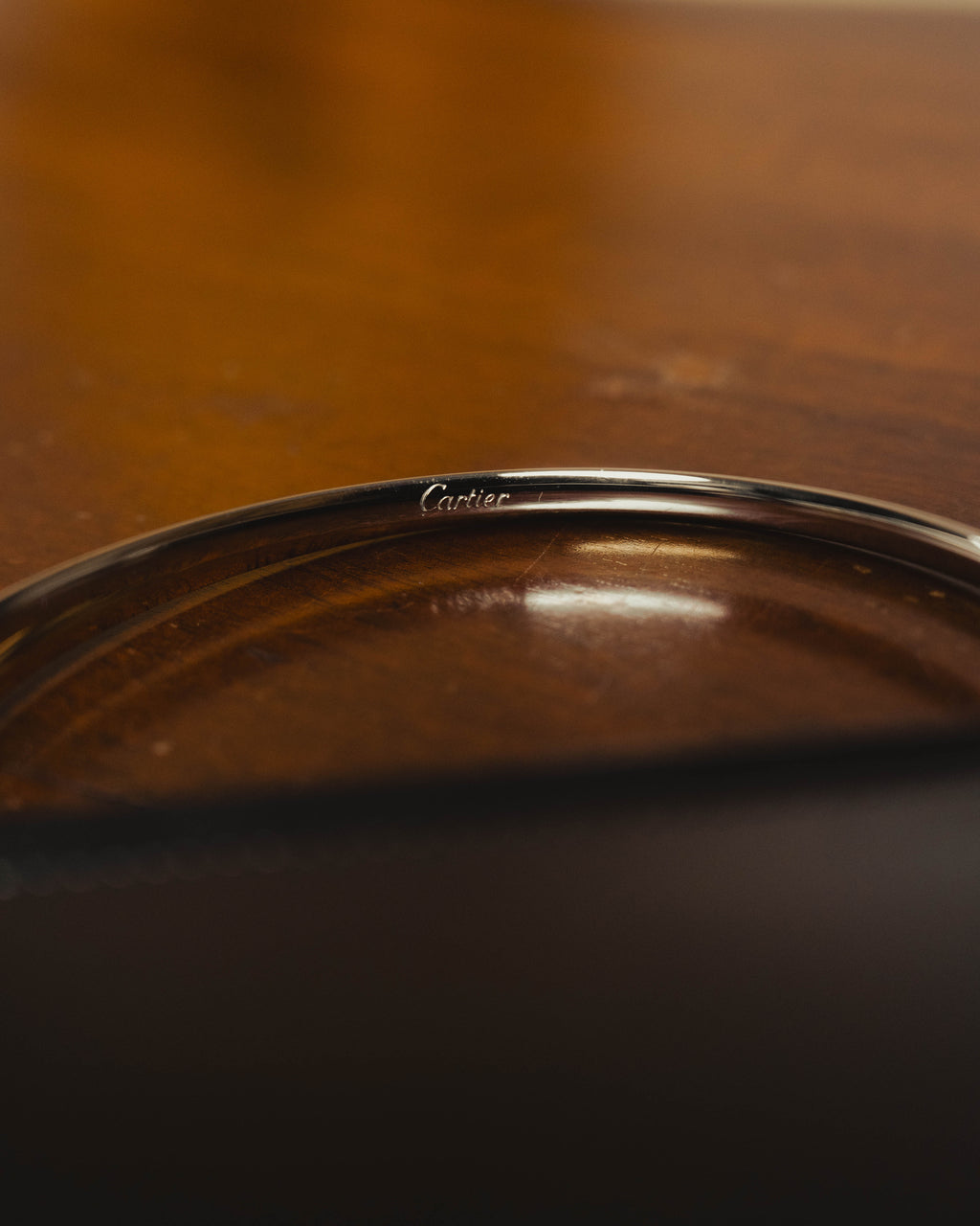 "Cartier" 80's Sculptural ring-handle leather wallet