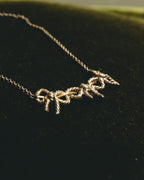 "Tiffany & Co." 80's-90's Sculptural triple bow necklace