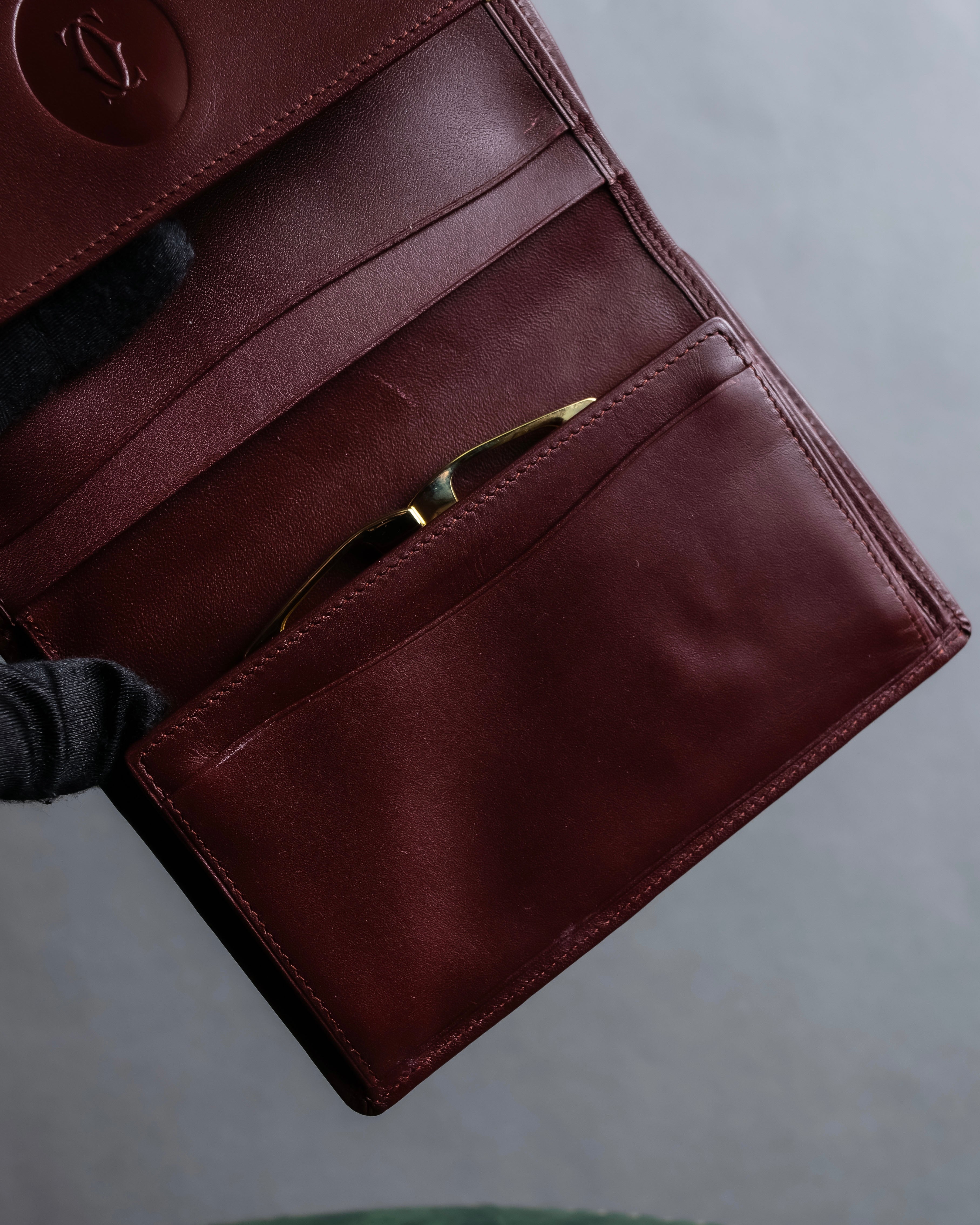 "Cartier" Les Must de Cartier bordeaux color leather wallet