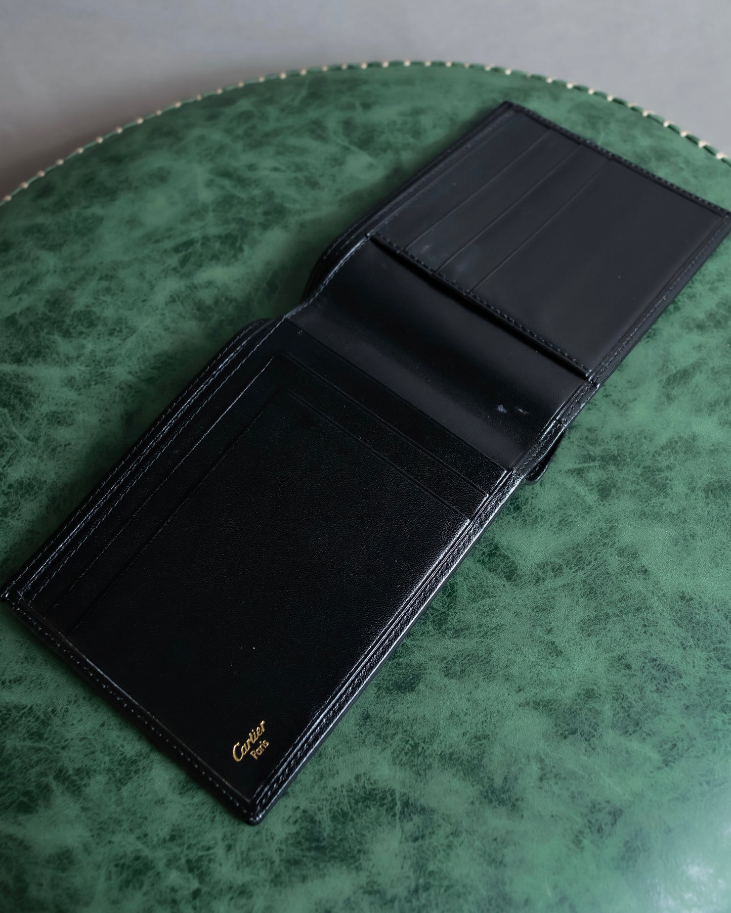 "Cartier" 2C logo engraved leather bi-fold wallet