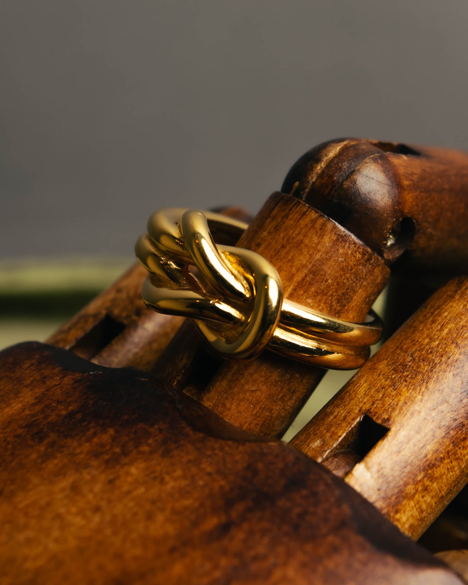 "HERMES" Sculptural gold tone knot Atame scarf ring