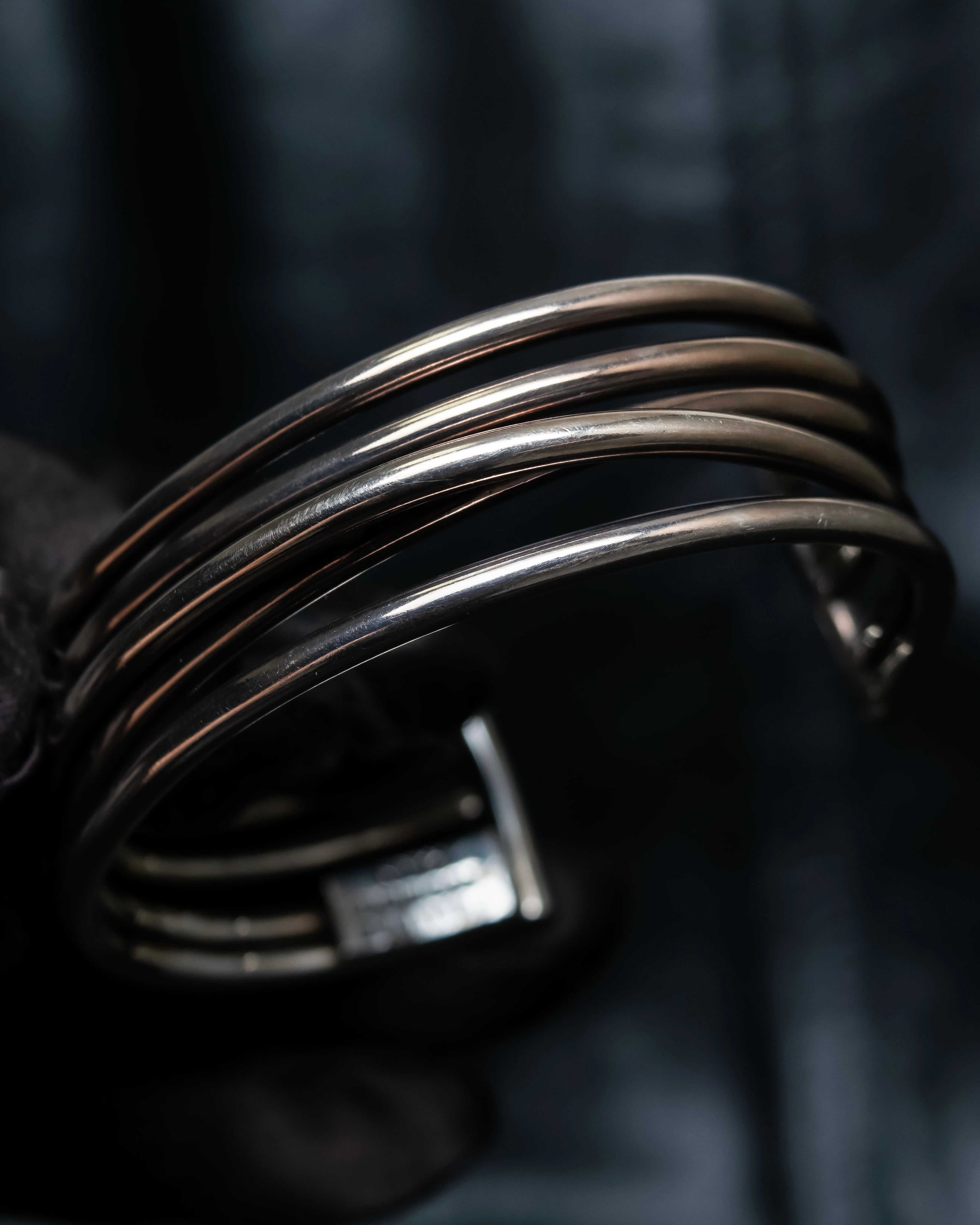 “PHILIPPE AUDIBERT” Crossed 5 line silver bangle