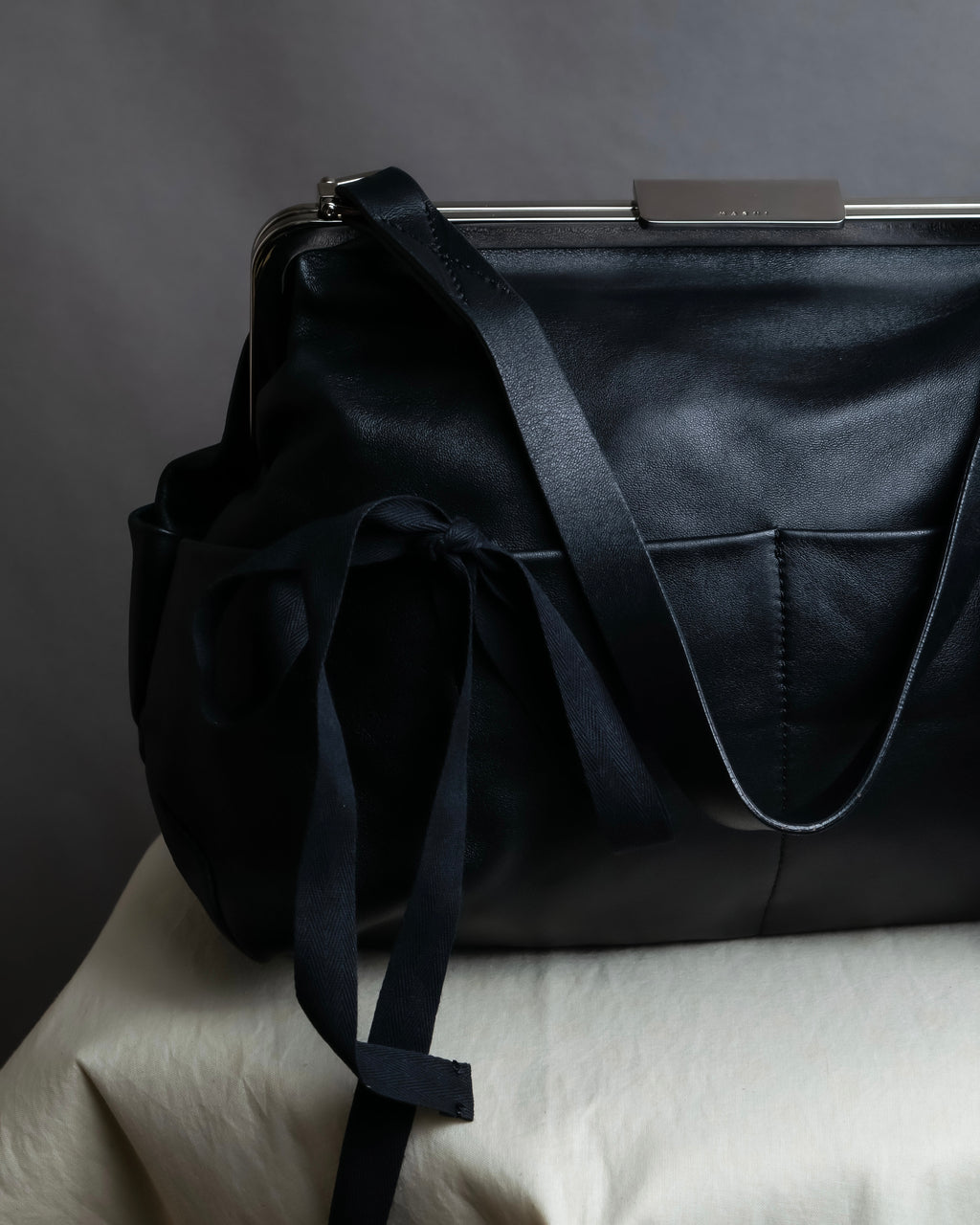 "MARNI" Side ribbon design rounded body leather bag