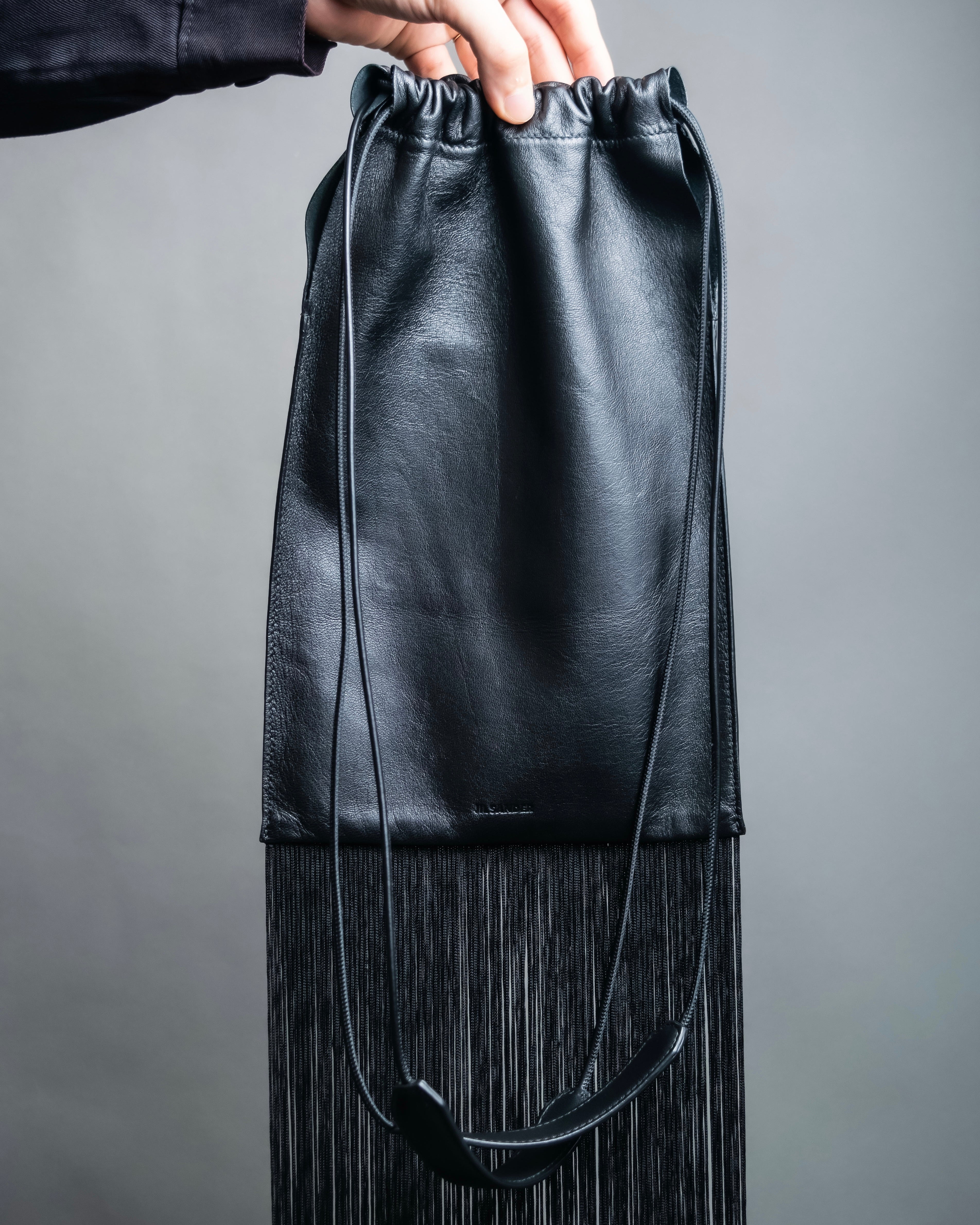“JIL SANDER” Fringe detail flat drawstring shoulder bag