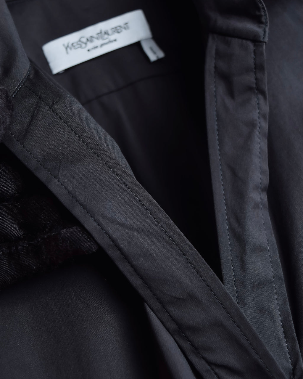 "Yves Saint Laurent Rive Gauche"
Twisted front sleeveless shirt