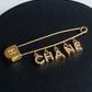 "CHANEL" Logo motif gold safety pin brooch