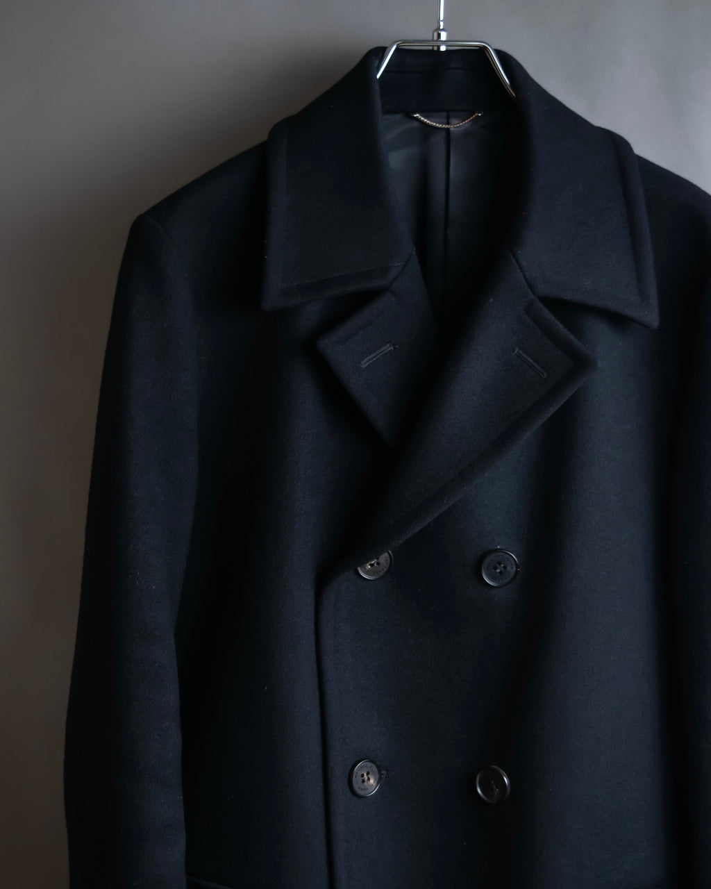 "JOHN LAWRENCE SULLIVAN"
 Large lapel double-breasted mid length coat