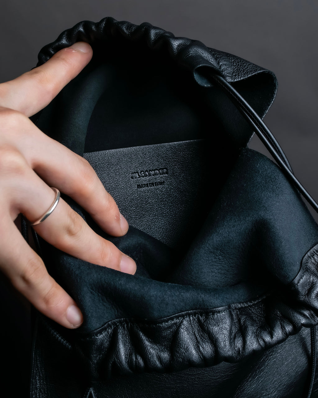 “JIL SANDER” Fringe detail flat drawstring shoulder bag