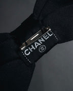 "CHANEL" 90’s black satin and grosgrain ribbon brooch