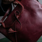 "Cartier" Texture changing bordeaux colored leather shoulder bag