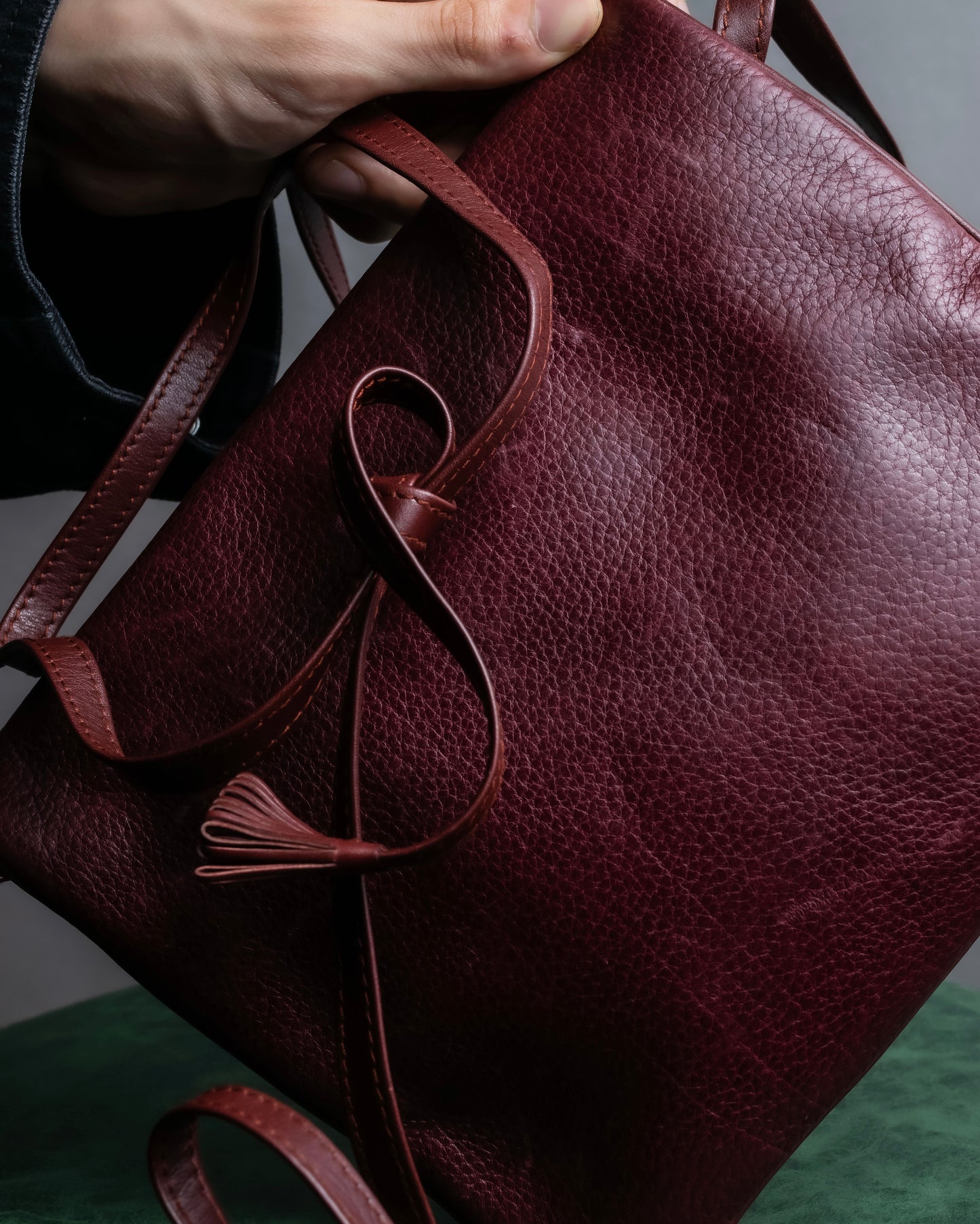 "Cartier" Texture changing bordeaux colored leather shoulder bag