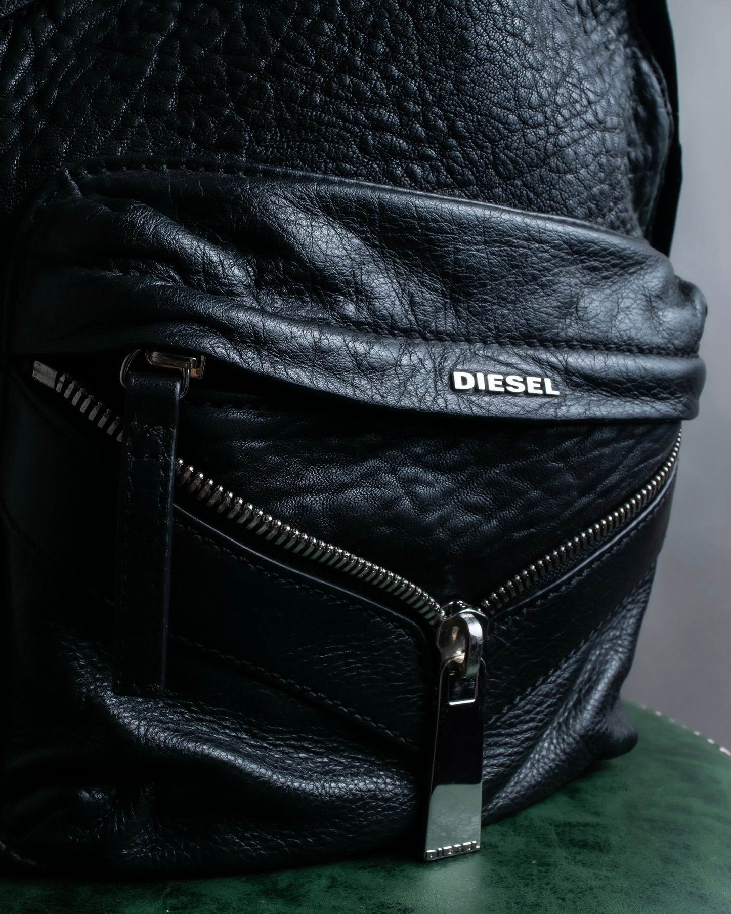 "DIESEL" Decorative zip design leather backpack