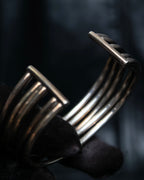 “PHILIPPE AUDIBERT” Crossed 5 line silver bangle