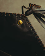 “Yves Saint Laurent” 70’s-80’s Perforated logo leather tassel shoulder bag
