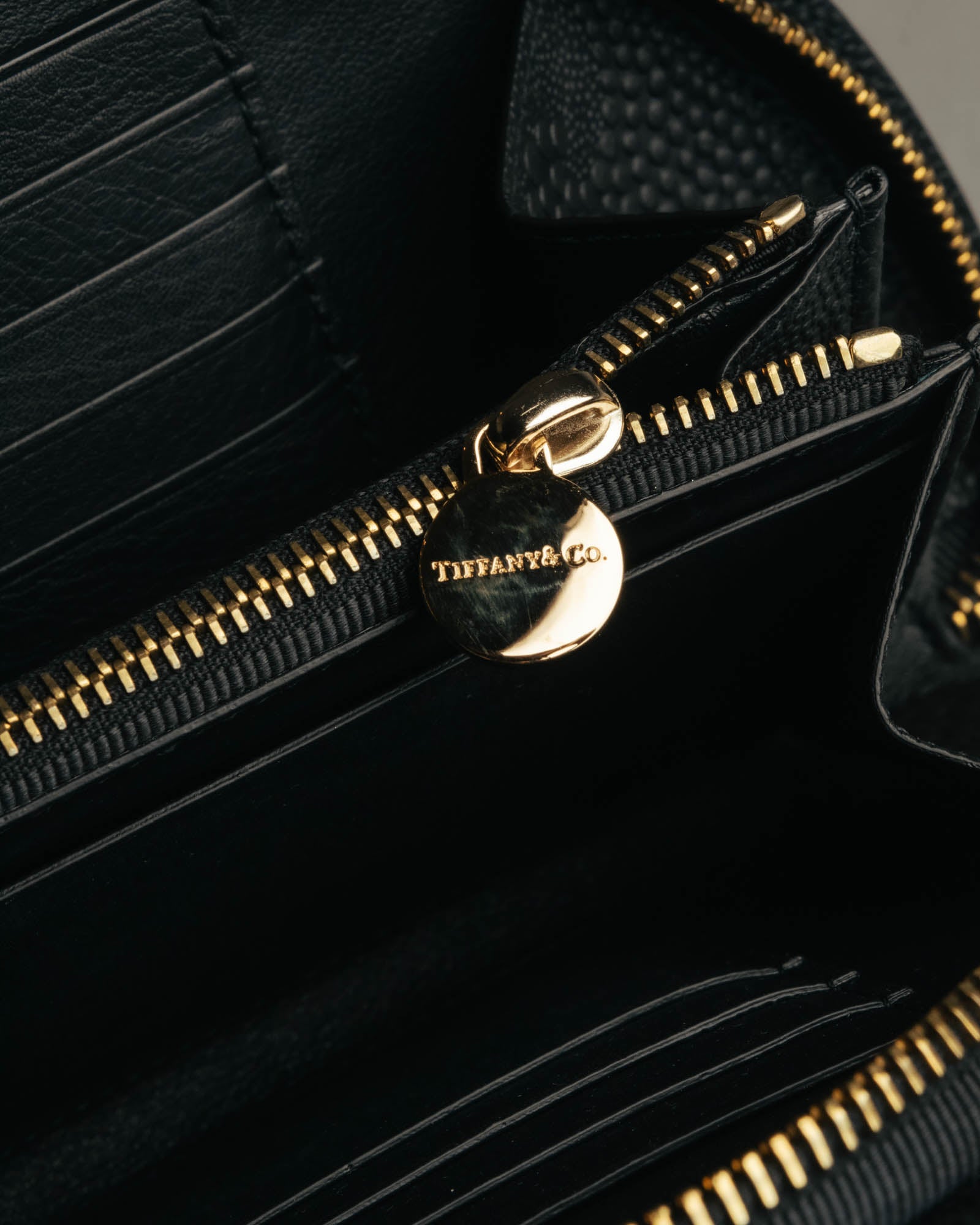 "Tiffany & Co." 10's-20's Embossed leather wristlet wallet