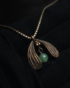 “Christian Dior” 90’s-00’s Antique gold botanical pendant necklace