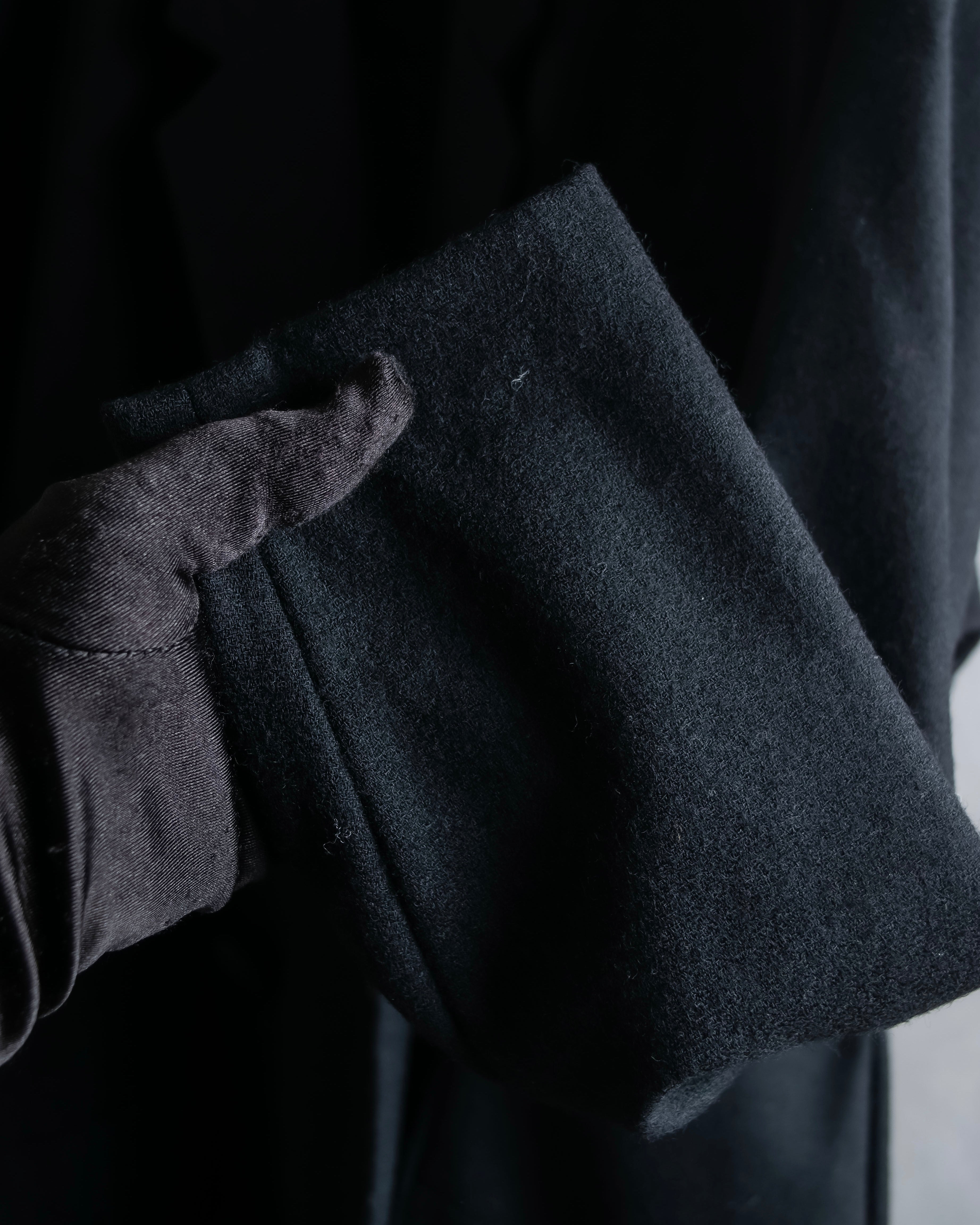 Tight-waisted wool shirt and black coat