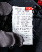 “Y’s COMPOSITION: SEE ATTACHED LABEL” Layered design multi buttons tail coat