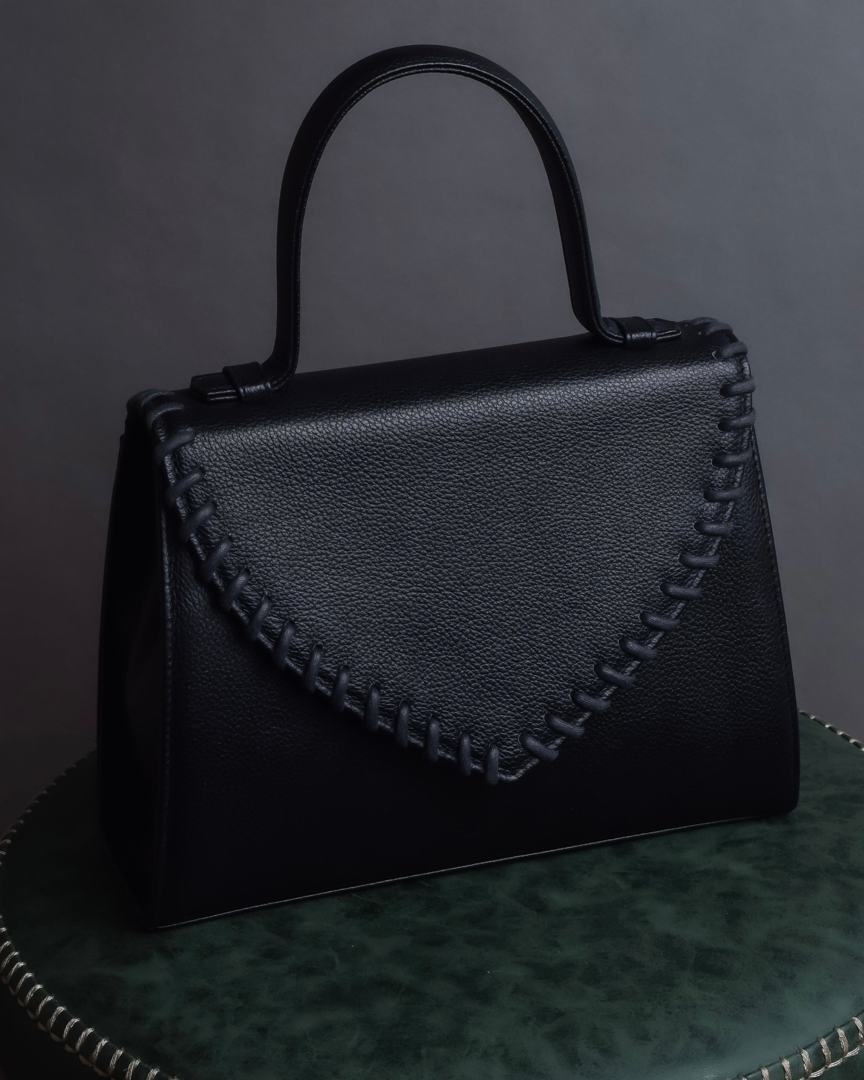 "YVES SAINT LAURENT" Hand stitched design trapezoid leather bag