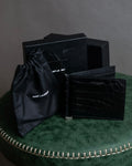 Cartera plegable de dinero con clip de dinero de cuero con relieve de cocodrilo de Saint Laurent