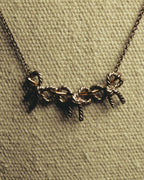 "Tiffany & Co." 80's-90's Sculptural triple bow necklace