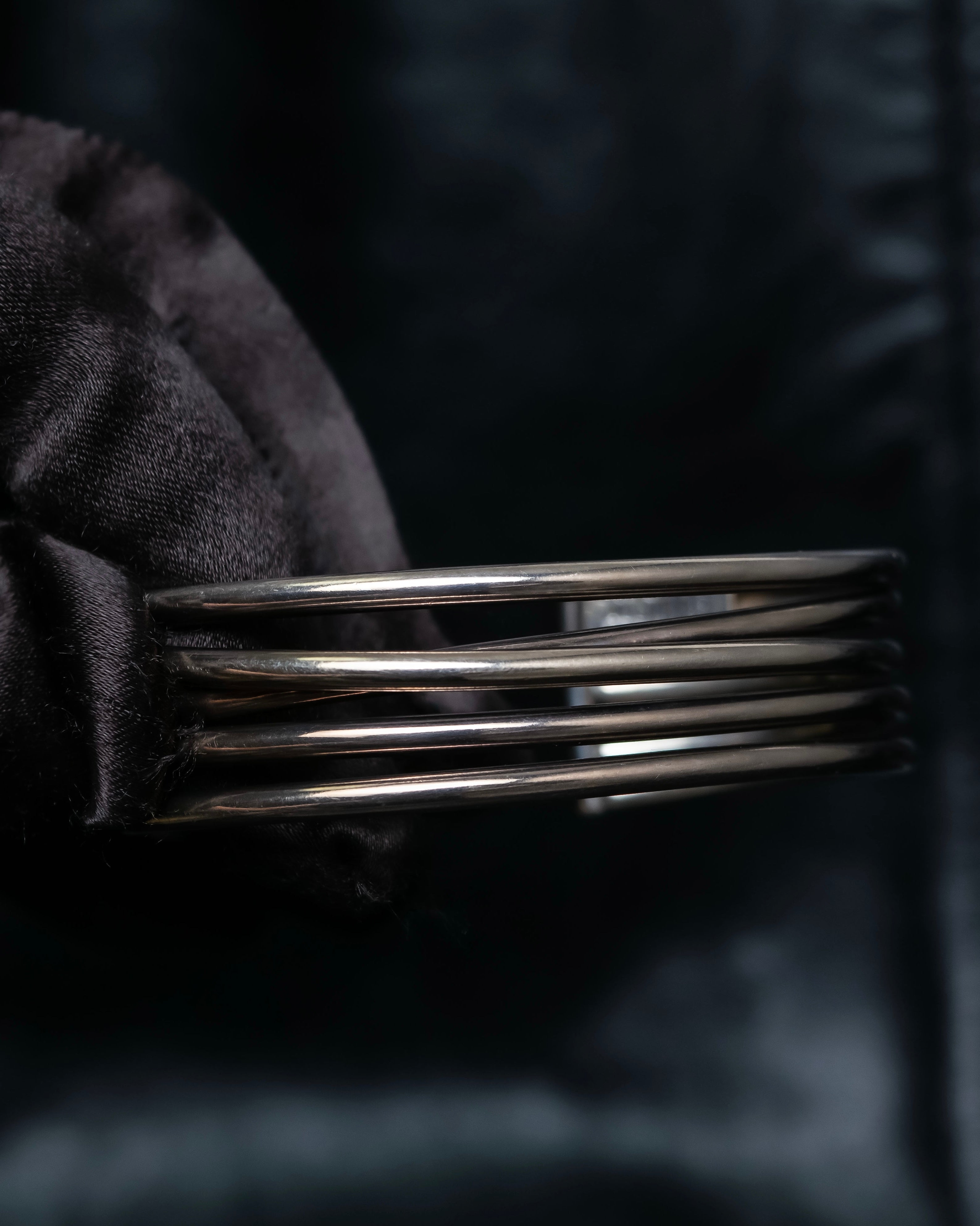 “PHILIPPE AUDIBERT” Crossed 5 line silver bangle