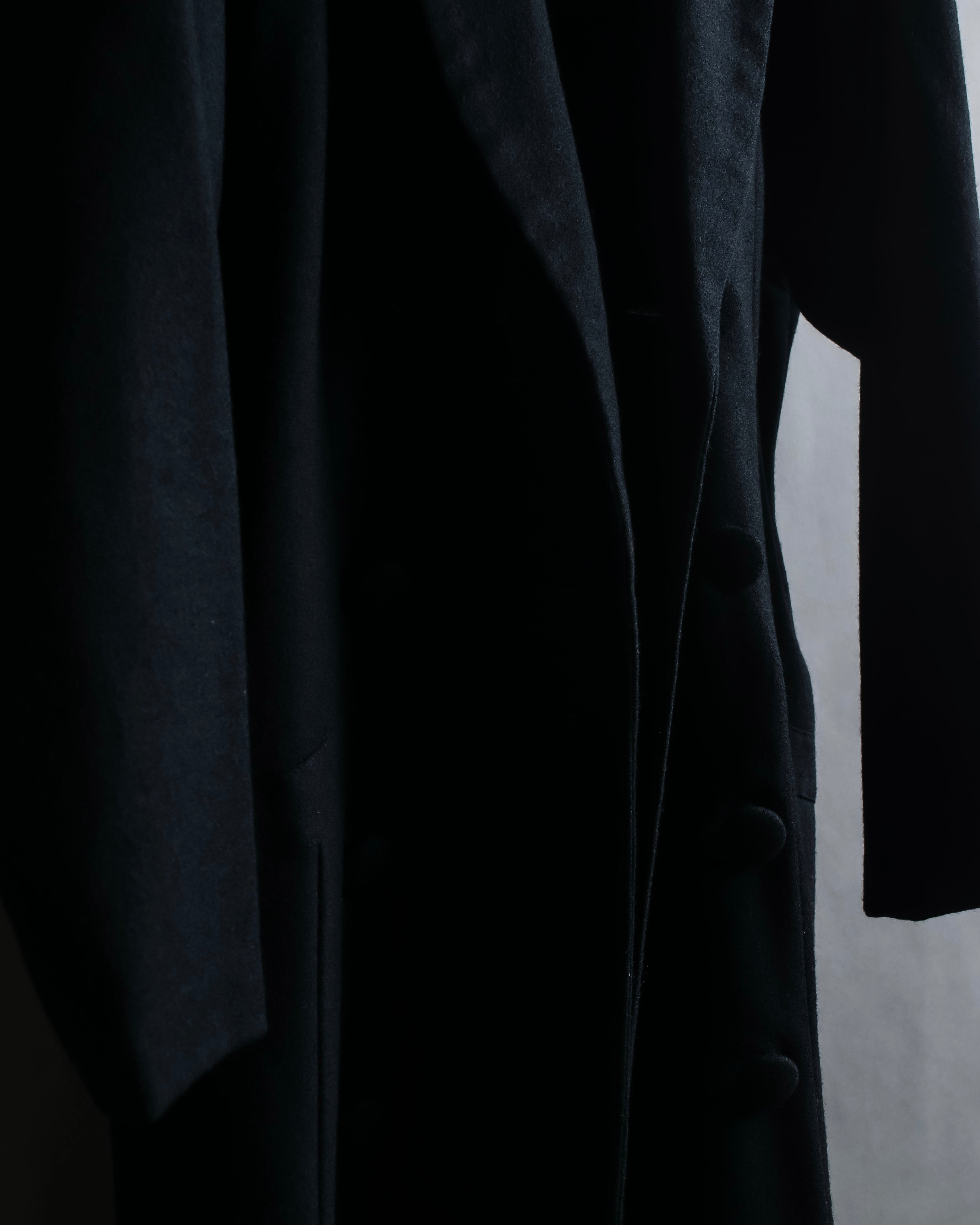 Tight-waisted wool shirt and black coat