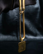 "Yves Saint Laurent" YSL logo plate gold necklace