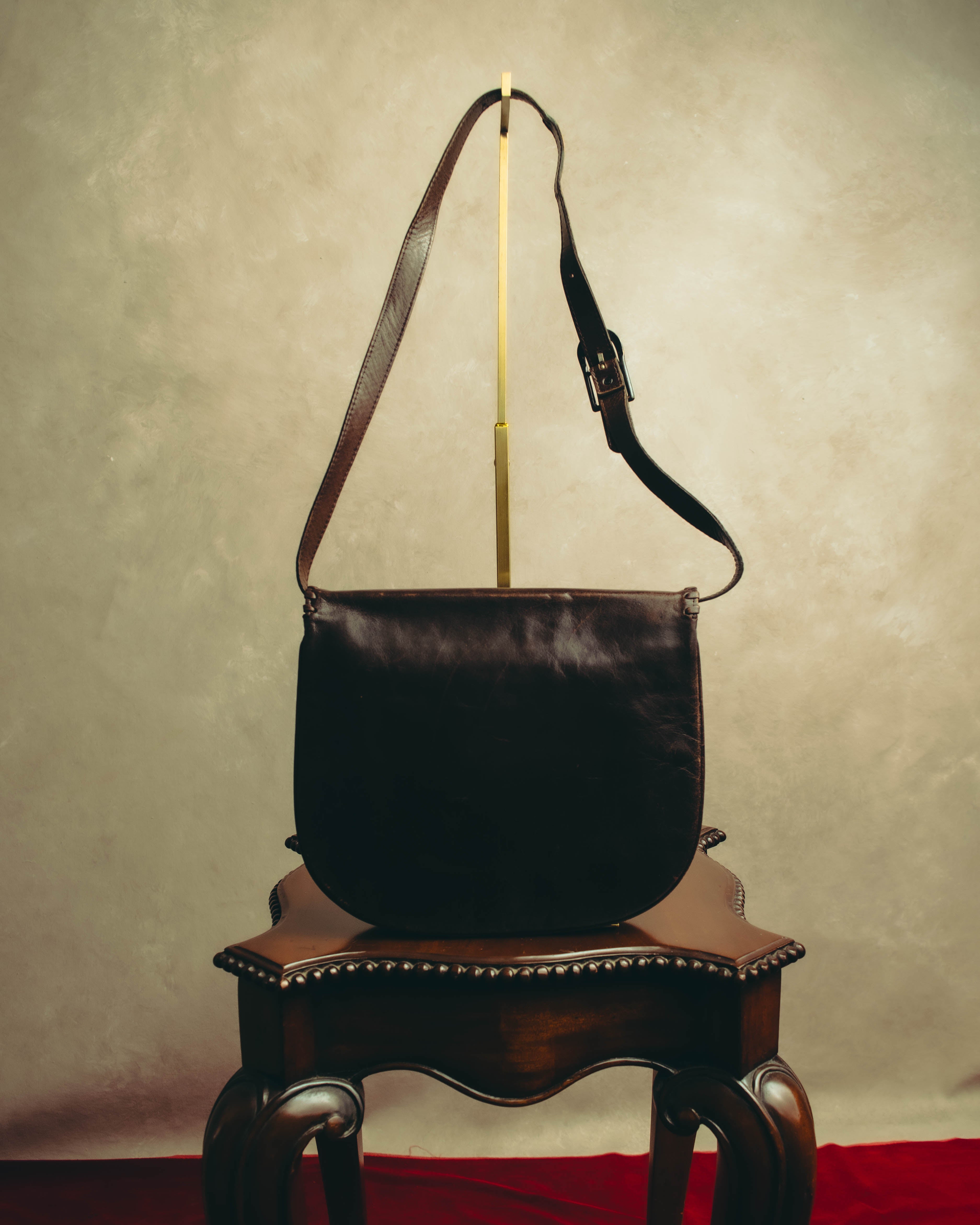 “Yves Saint Laurent” 70’s-80’s Perforated logo leather tassel shoulder bag