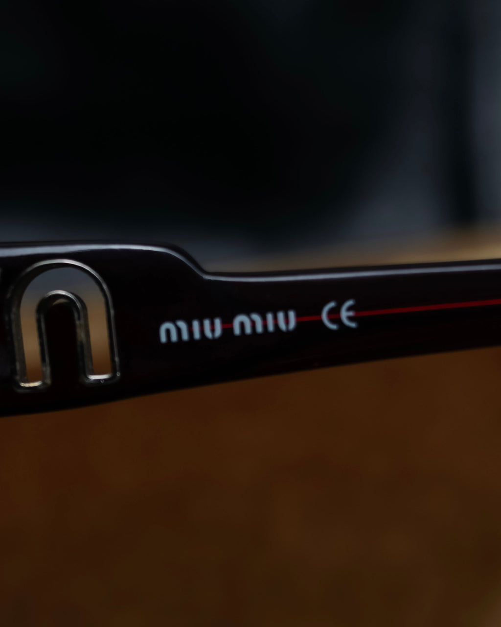"Miu Miu" reddish brown sporty sunglasses
