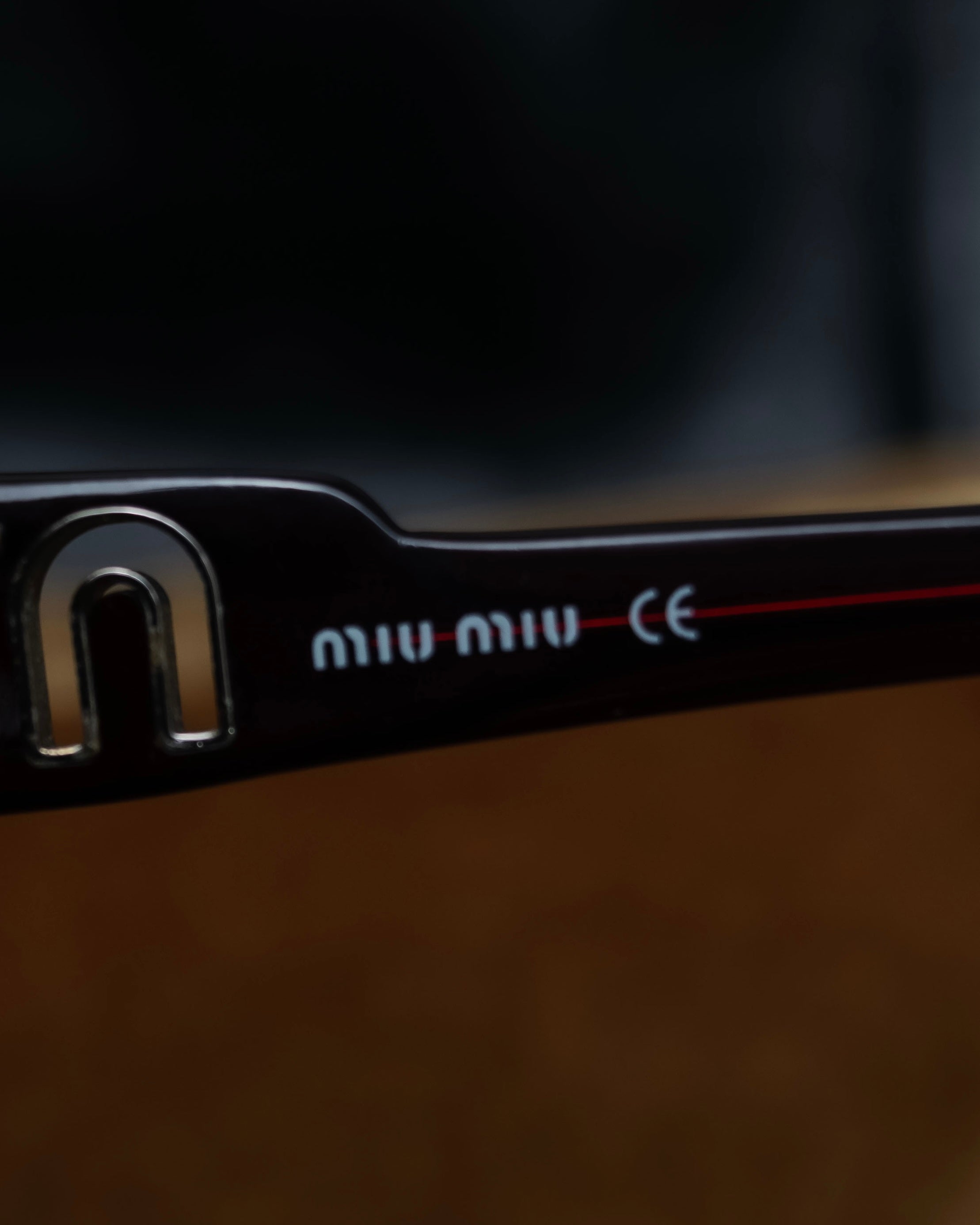 "Miu Miu" reddish brown sporty sunglasses