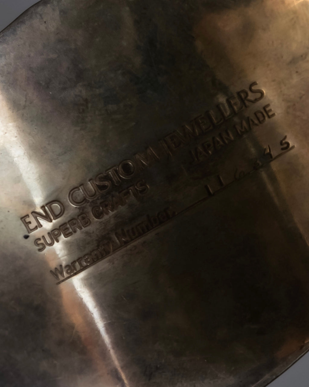 "END CUSTOM JEWELLERS" Square pattern wavy silver bangle