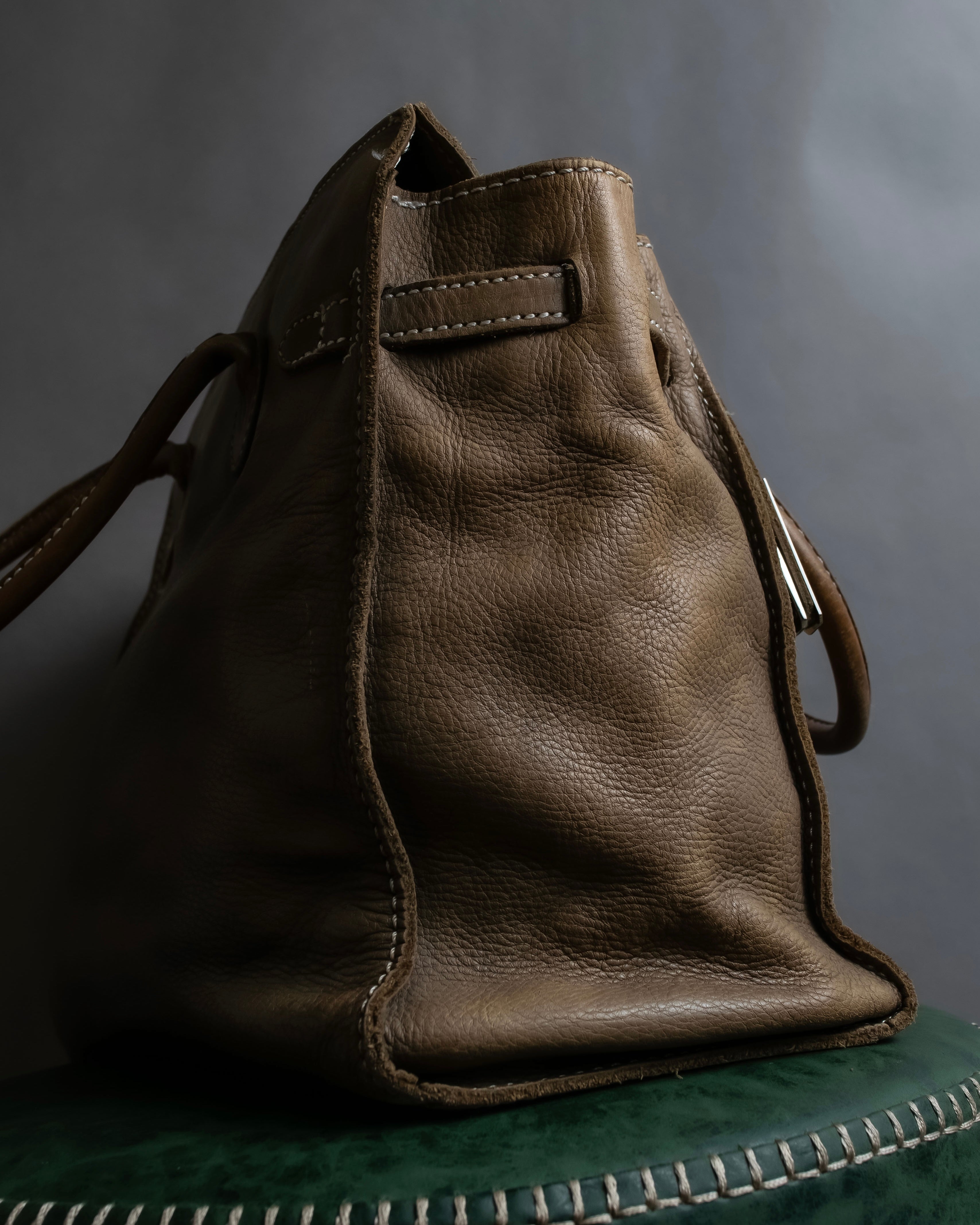 "Mademoiselle Accessories"
 Silver parts design leather one handle bag