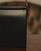 "Cartier" 80's Sculptural ring-handle leather wallet