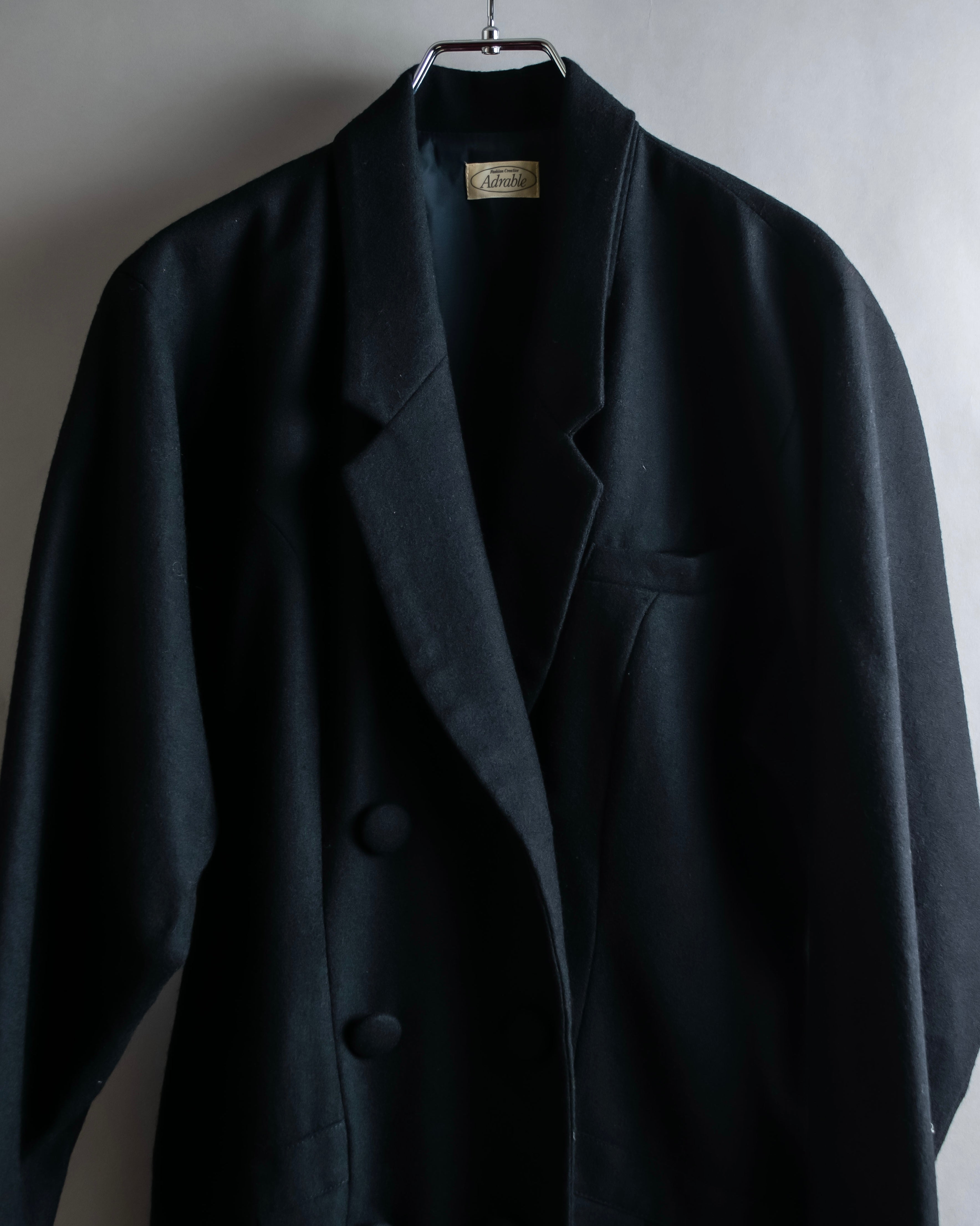 Tight-waisted wool shirt and black coat