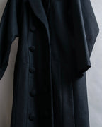 Tight-waisted wool shirt and black coat