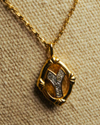 "Yves Saint Laurent" 80's-90's Gold tone rhinestone pendant necklace