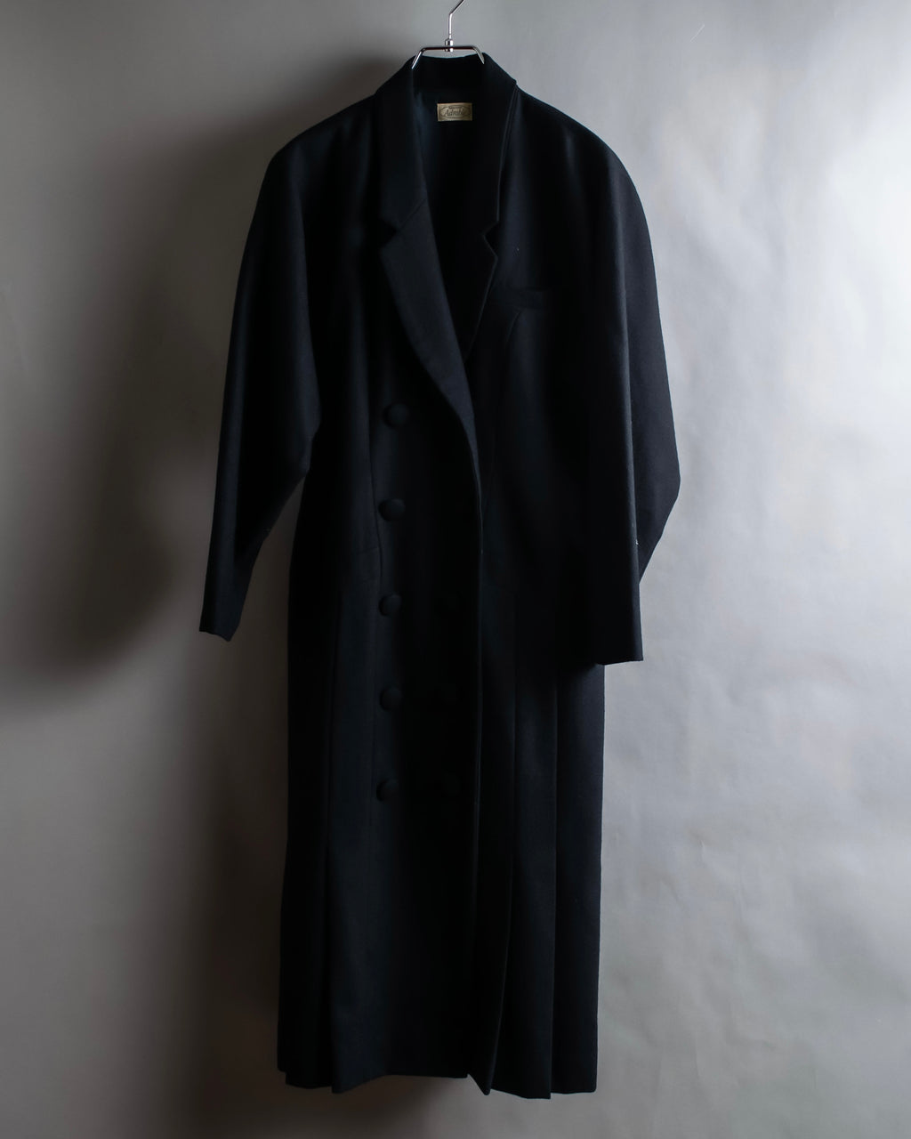 Tight-waisted wool shirt and black coat