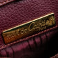 "Cartier" Texture changing bordeaux colored leather shoulder bag