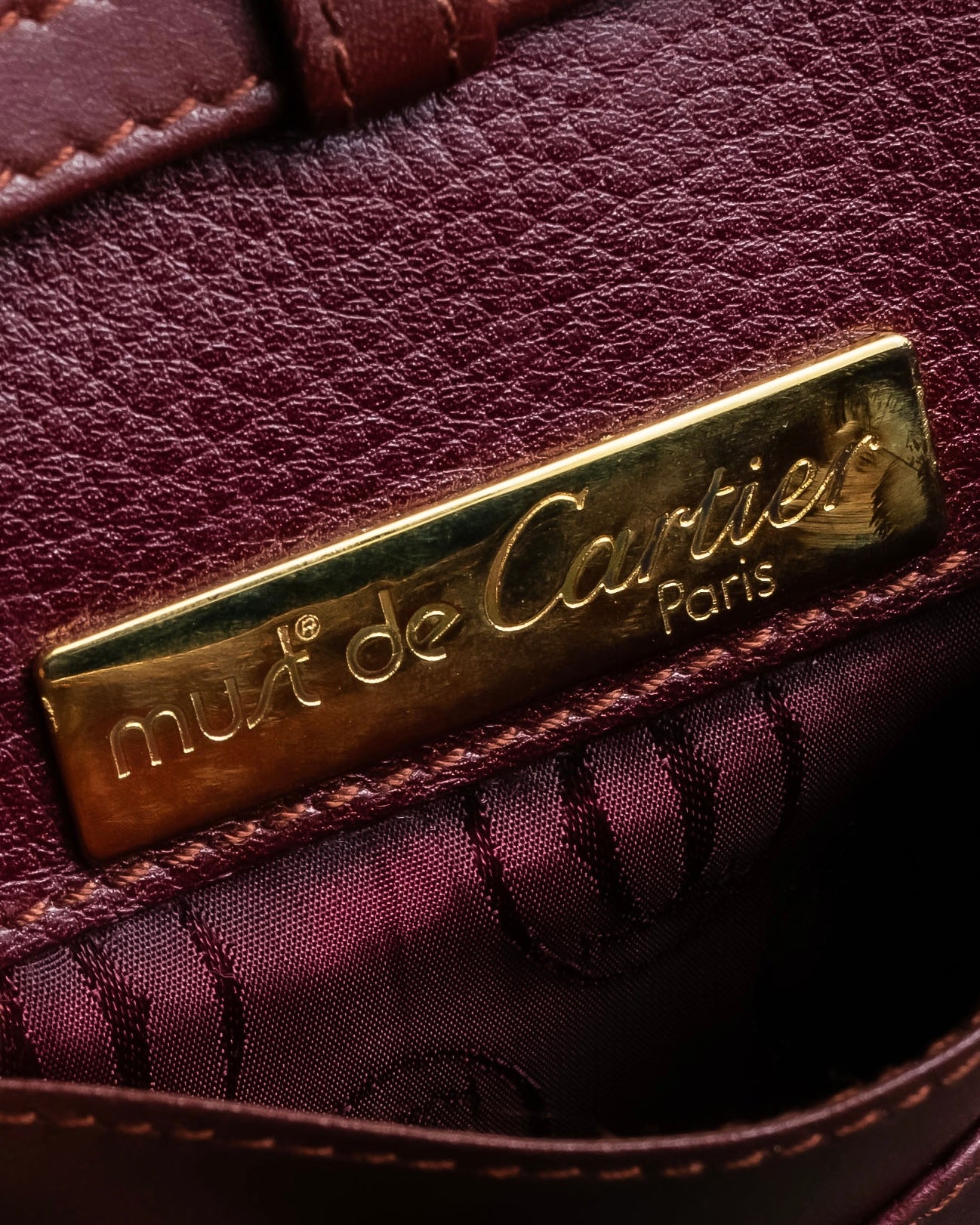 "Cartier" Texture changing bordeaux colored leather shoulder bag