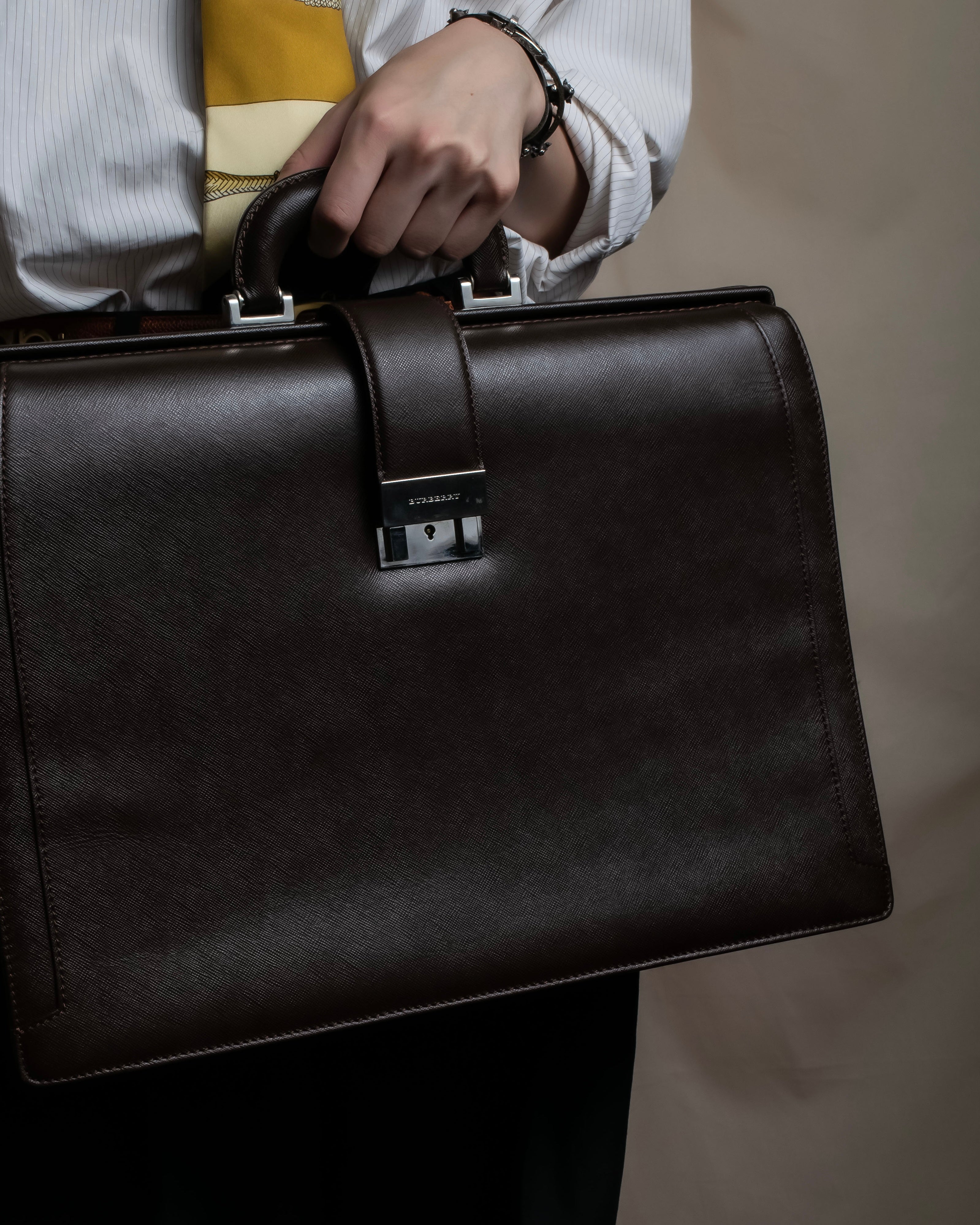 "BURBERRY" Metal belt design embossed PVC briefcase