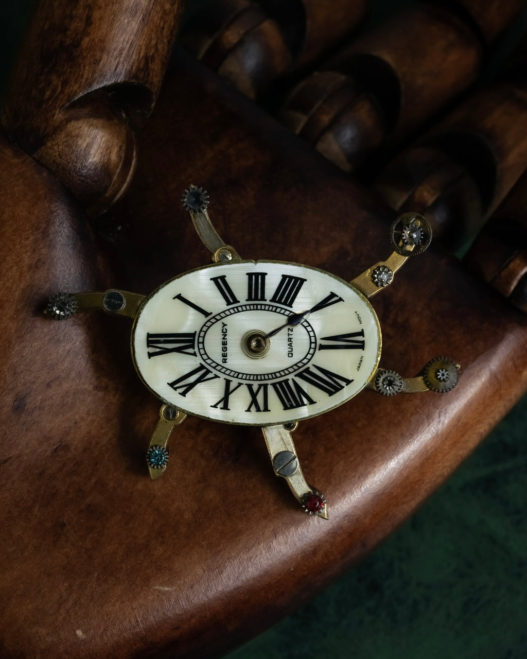 "Jerry Robertson design clock motif brooch"