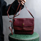 "Cartier" Texture changing bordeaux colored leather shoulder bag