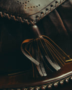 “Yves Saint Laurent” 70’s-80’s Perforated logo leather tassel shoulder bag