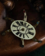 "Jerry Robertson design clock motif brooch"