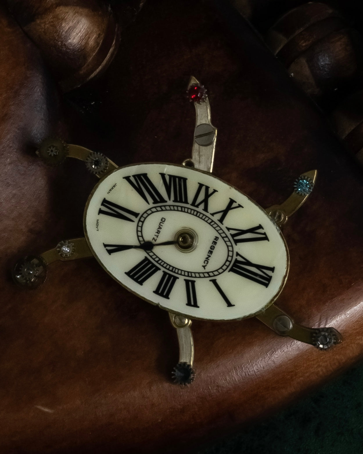 "Jerry Robertson design clock motif brooch"